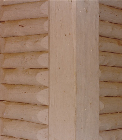 Log wall. Photo taken in 1979